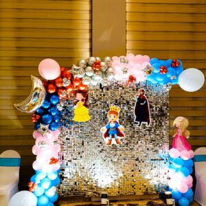 Royal Prince and Princess themed balloon decoration with character cutouts and sequin backdrop in Jaipur.