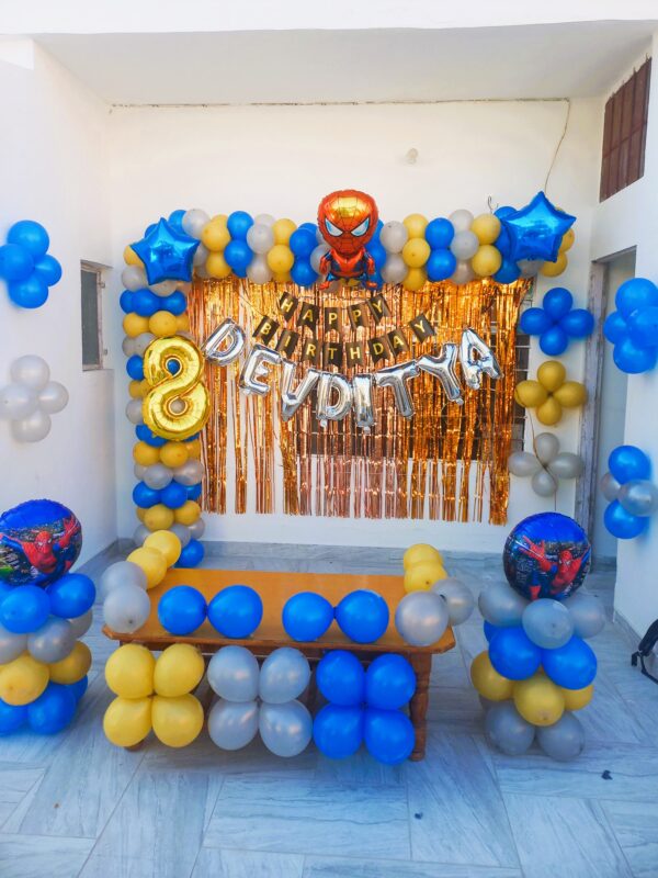 Vibrant Spiderman theme birthday balloon decoration in blue, yellow, and red for a boy's 8th birthday in Jaipur.