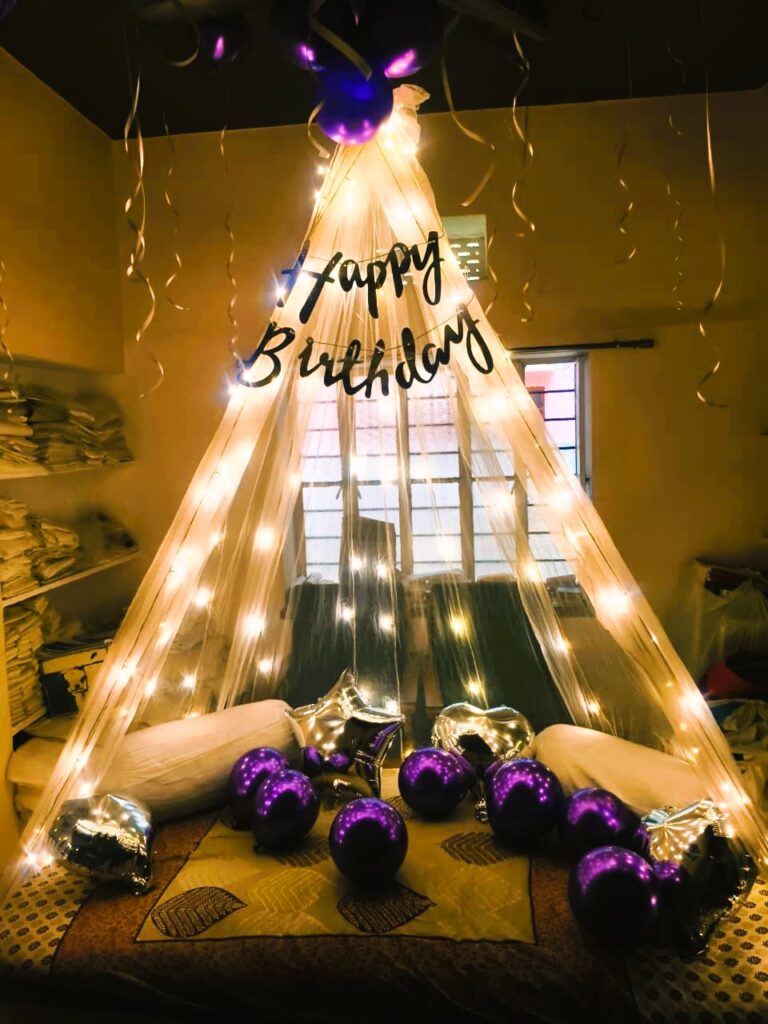 Dreamy canopy birthday balloon setup with fairy lights in Jaipur by Manhagift