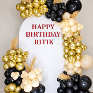 Luxury black gold and ivory birthday balloon decoration with personalised backdrop in Jaipur