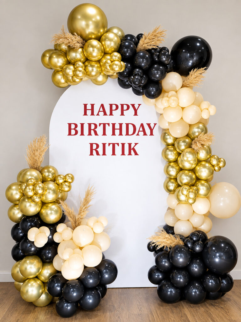 Luxury black gold and ivory birthday balloon decoration with personalised backdrop in Jaipur